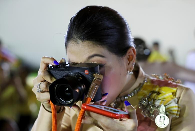 Thailand's Princess Sirivannavari Nariratana takes pictures after a religious ceremony to commemorate the death of King Chulalongkorn, known as King Rama V, at The Grand Palace in Bangkok, Thailand. REUTERS/Athit Perawongmetha